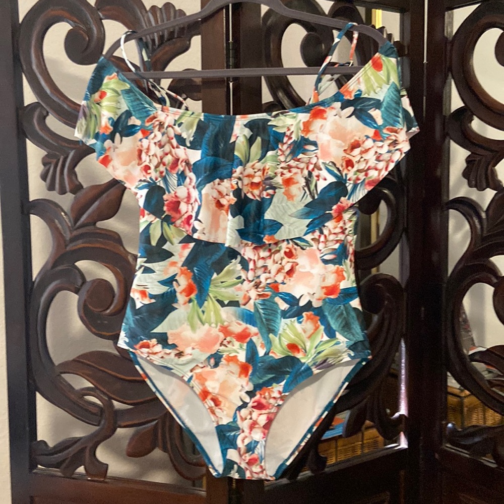 Flirty off the shoulder ruffled full piece bathing suit.